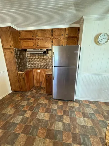 a bed sitting in a room next to a window