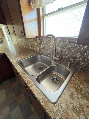 a view of a wooden deck with a yard