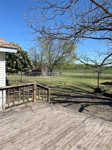 a view of a field with an trees
