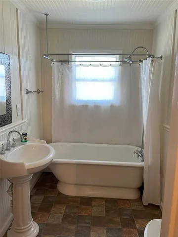 a bathroom with a sink a toilet and mirror