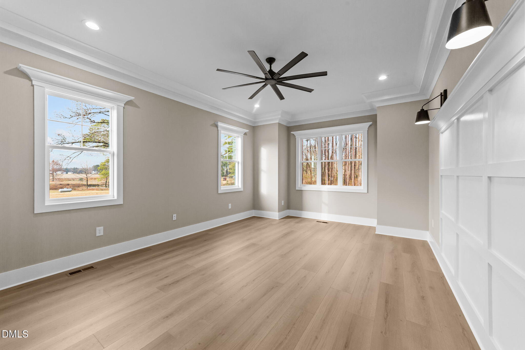 2590 Lassiter Road Four Oaks, NC 27524 - Photo 33 of 72 a view of an empty room with a window and wooden floor