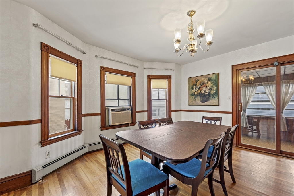 12 Foster Street Everett, MA 02149 - Photo 11 of 29 a view of a dining room with furniture window and wooden floor