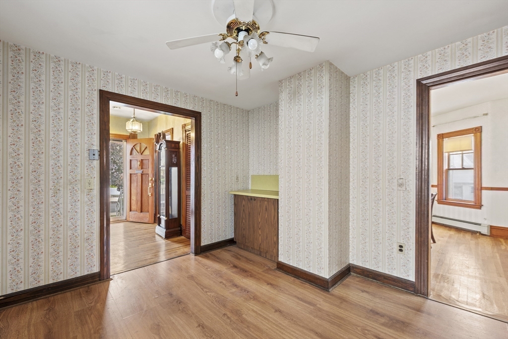 12 Foster Street Everett, MA 02149 - Photo 14 of 29 wooden floor in an empty room with a window