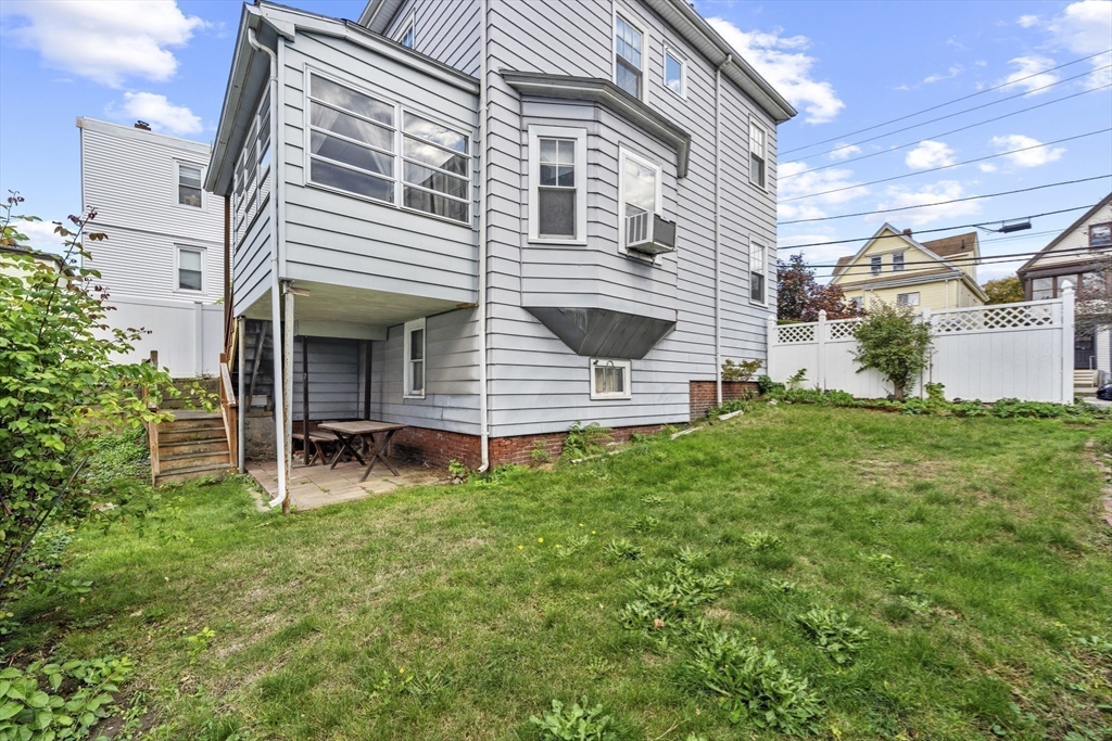 12 Foster Street Everett, MA 02149 - Photo 28 of 29 a view of a house with a backyard