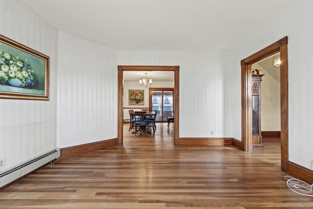 12 Foster Street Everett, MA 02149 - Photo 8 of 29 a view of empty room with wooden floor