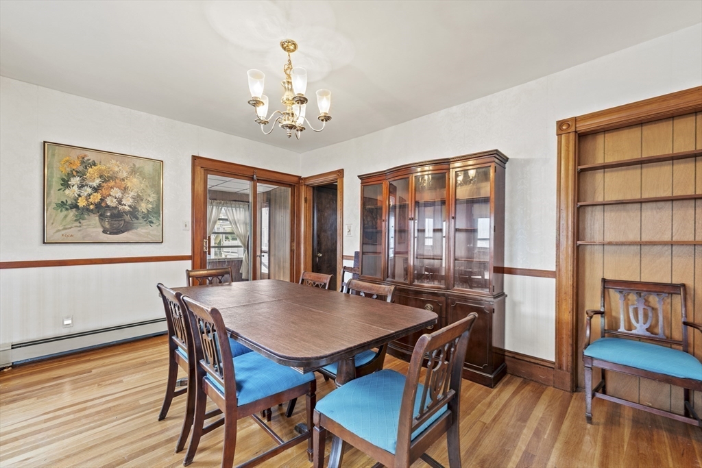 12 Foster Street Everett, MA 02149 - Photo 9 of 29 a view of a dining room with furniture window and wooden floor