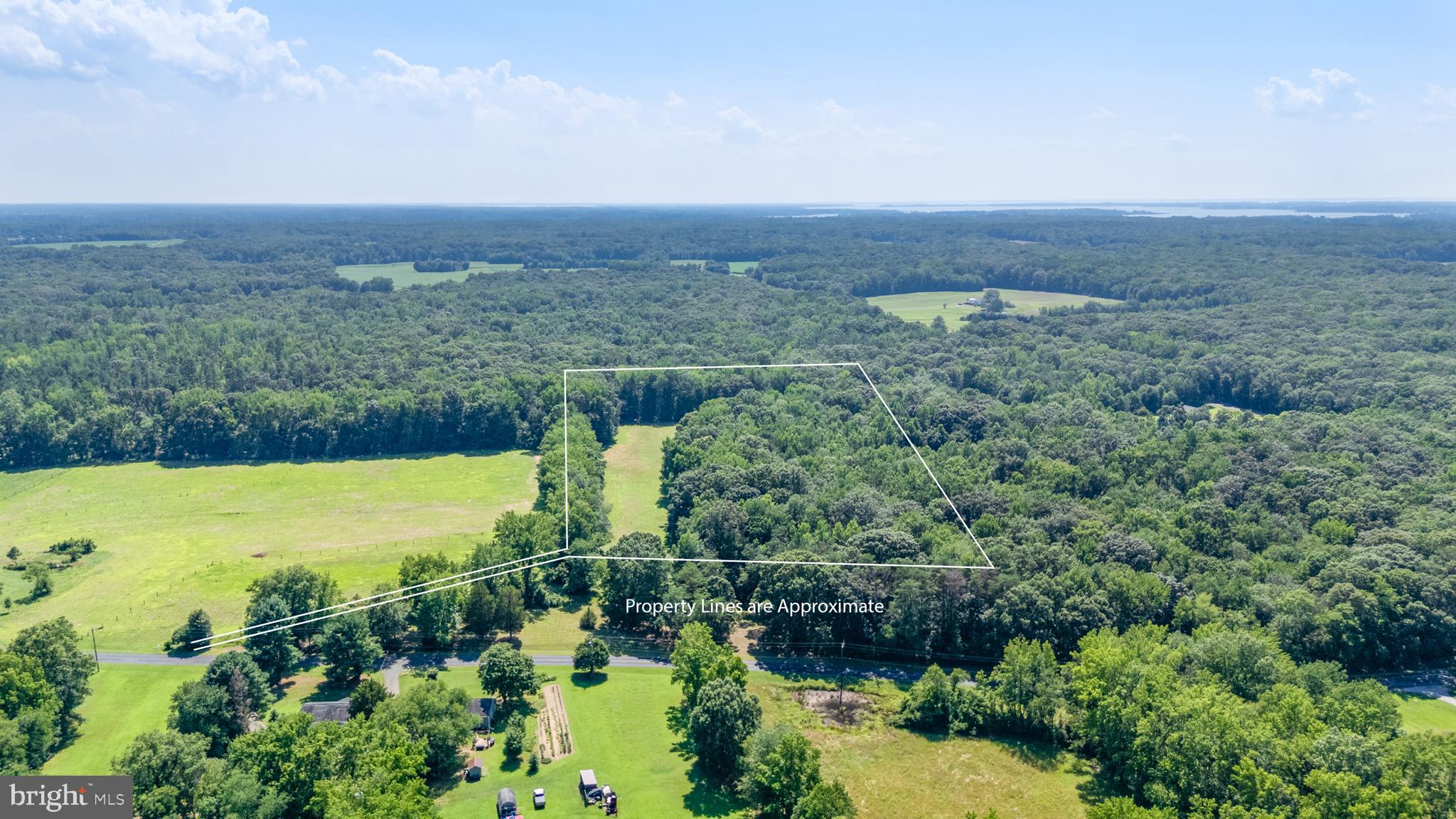 Hatchett Road Centreville, MD 21617 - Photo 3 of 6 a view of a lake with a city