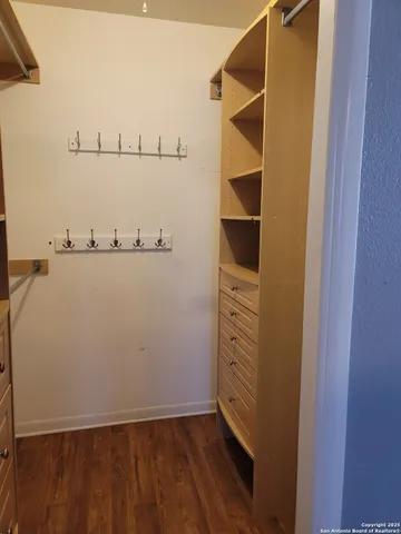 a view of an empty walk in closet
