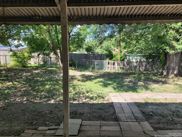 a backyard of a house with lots of green space