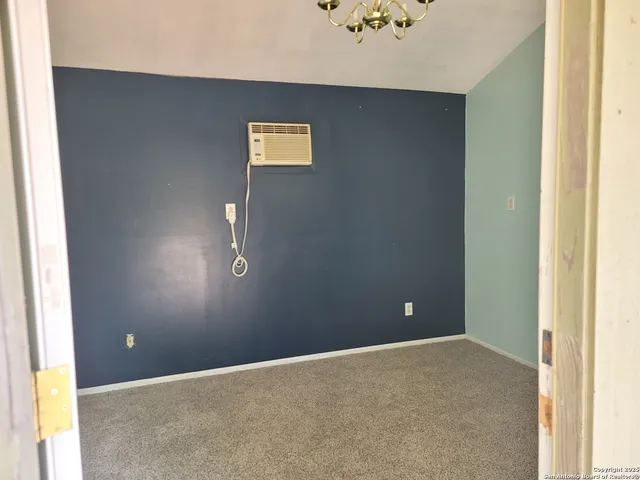 a view of a livingroom with an empty space and window