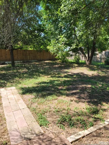 a view of a yard with an outdoor space