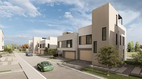 a view of a city street lined with tall buildings