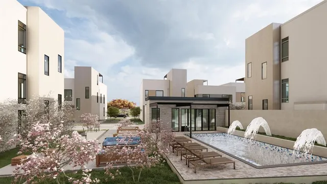 a backyard of a house with table and chairs