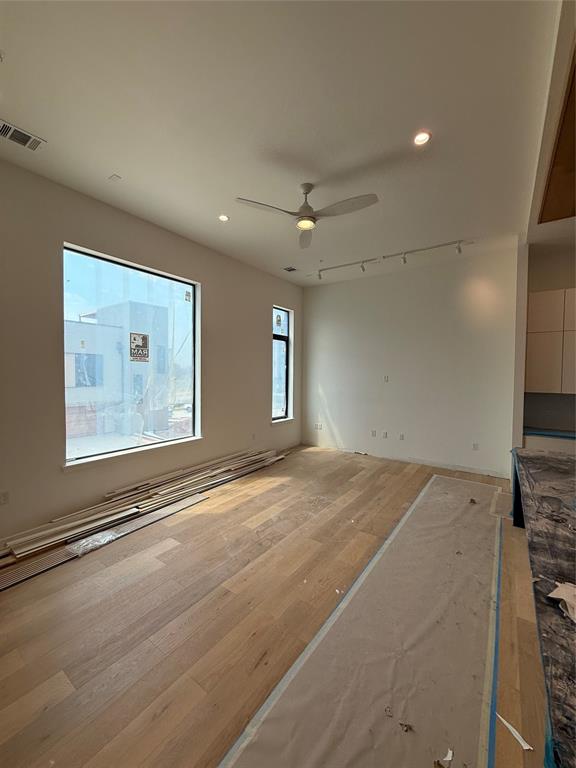 1111 Raiford Road, Unit 112 Carrollton, TX 75007 - Photo 6 of 19 an empty room with windows and entrance