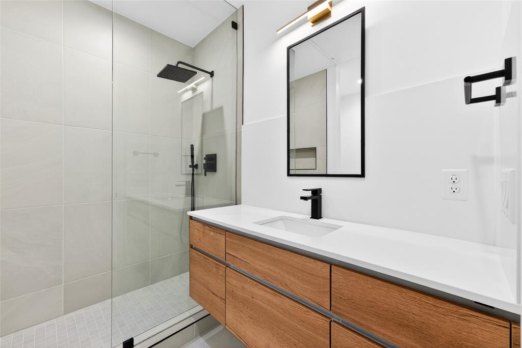 1111 Raiford Road, Unit 112 Carrollton, TX 75007 - Photo 9 of 30 a bathroom with a sink and a mirror