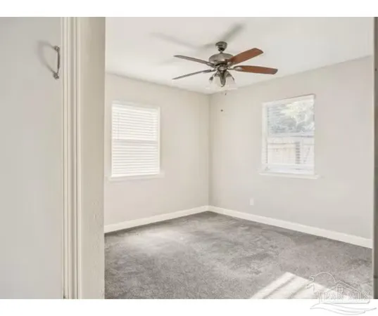 a view of an empty room with a window