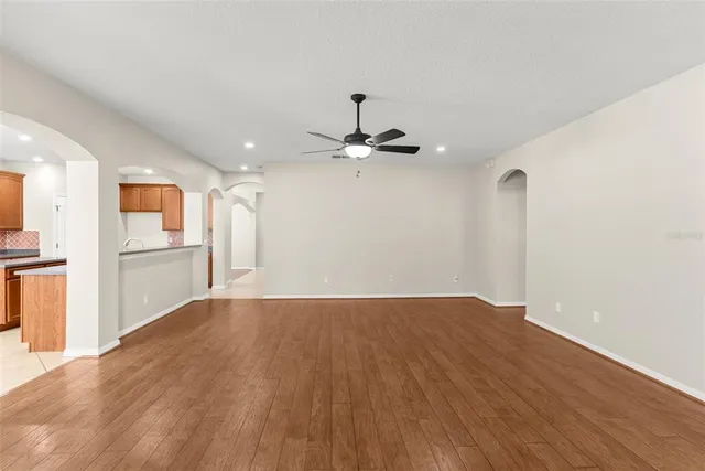 a view of a kitchen with wooden floor and a kitchen