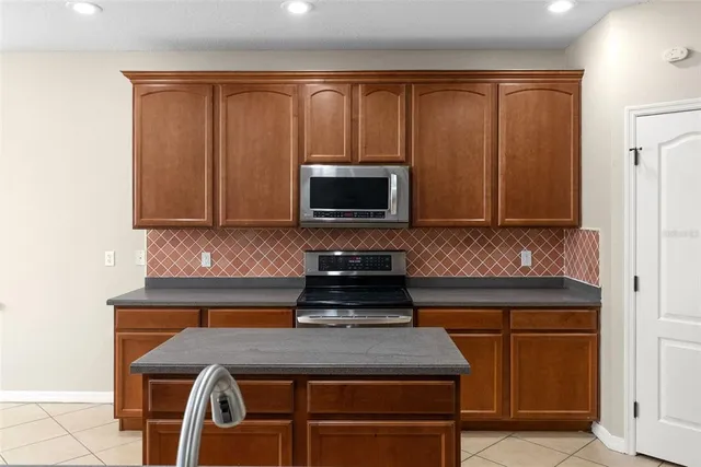 a kitchen with a stove and a microwave