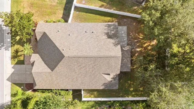 an aerial view of a house with swimming pool
