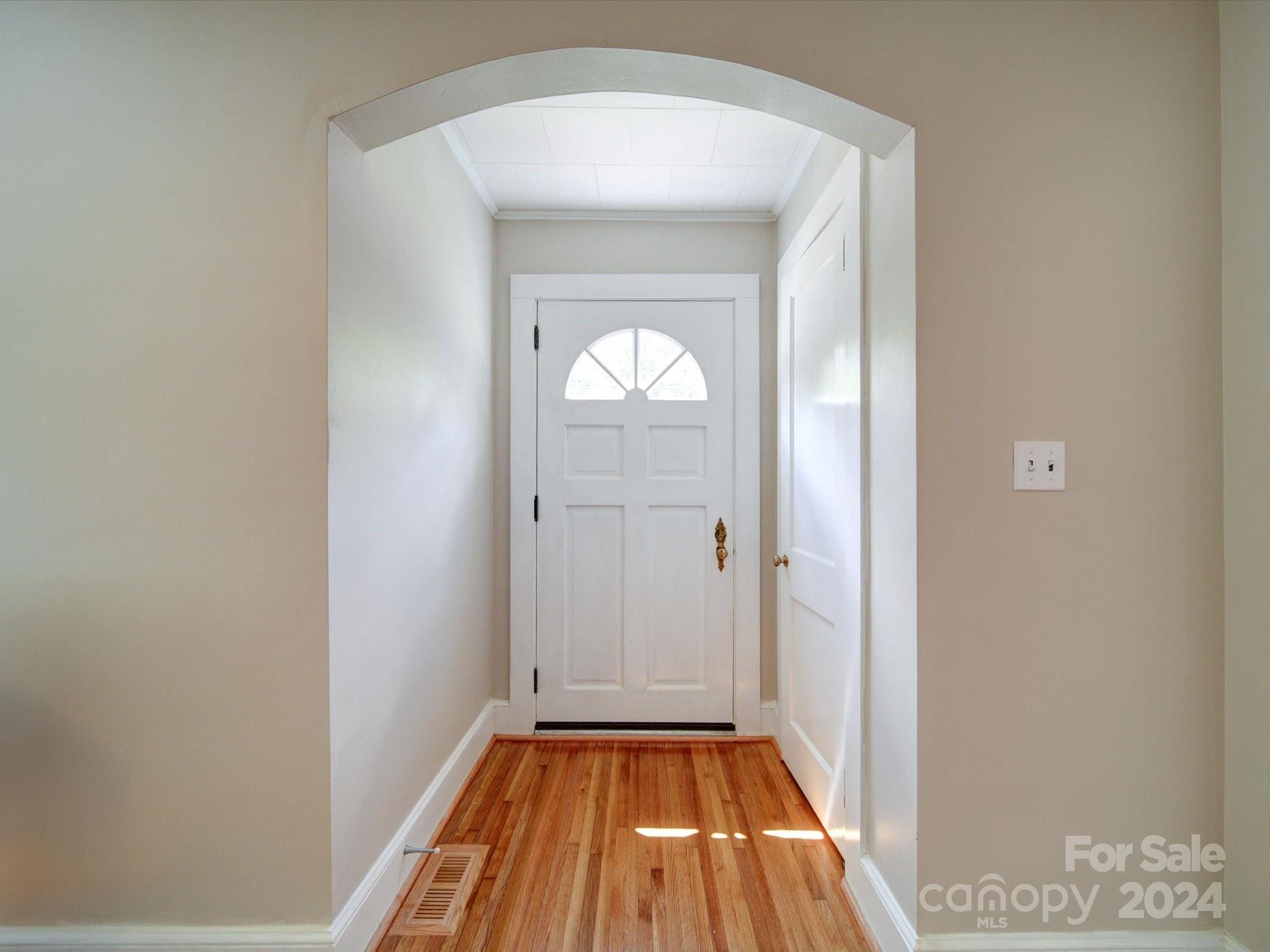 1102 White Store Road Wadesboro, NC 28170 - Photo 19 of 35 a view of a hallway with wooden floor and a livingroom