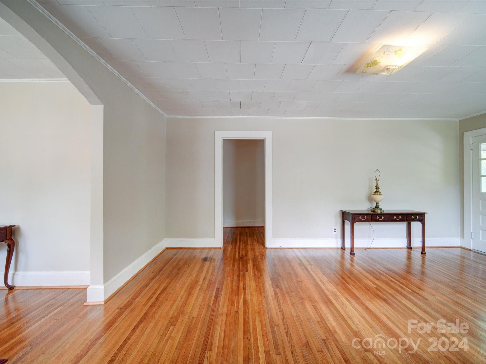 1102 White Store Road Wadesboro, NC 28170 - Photo 20 of 35 a view of a livingroom with wooden floor and a piano