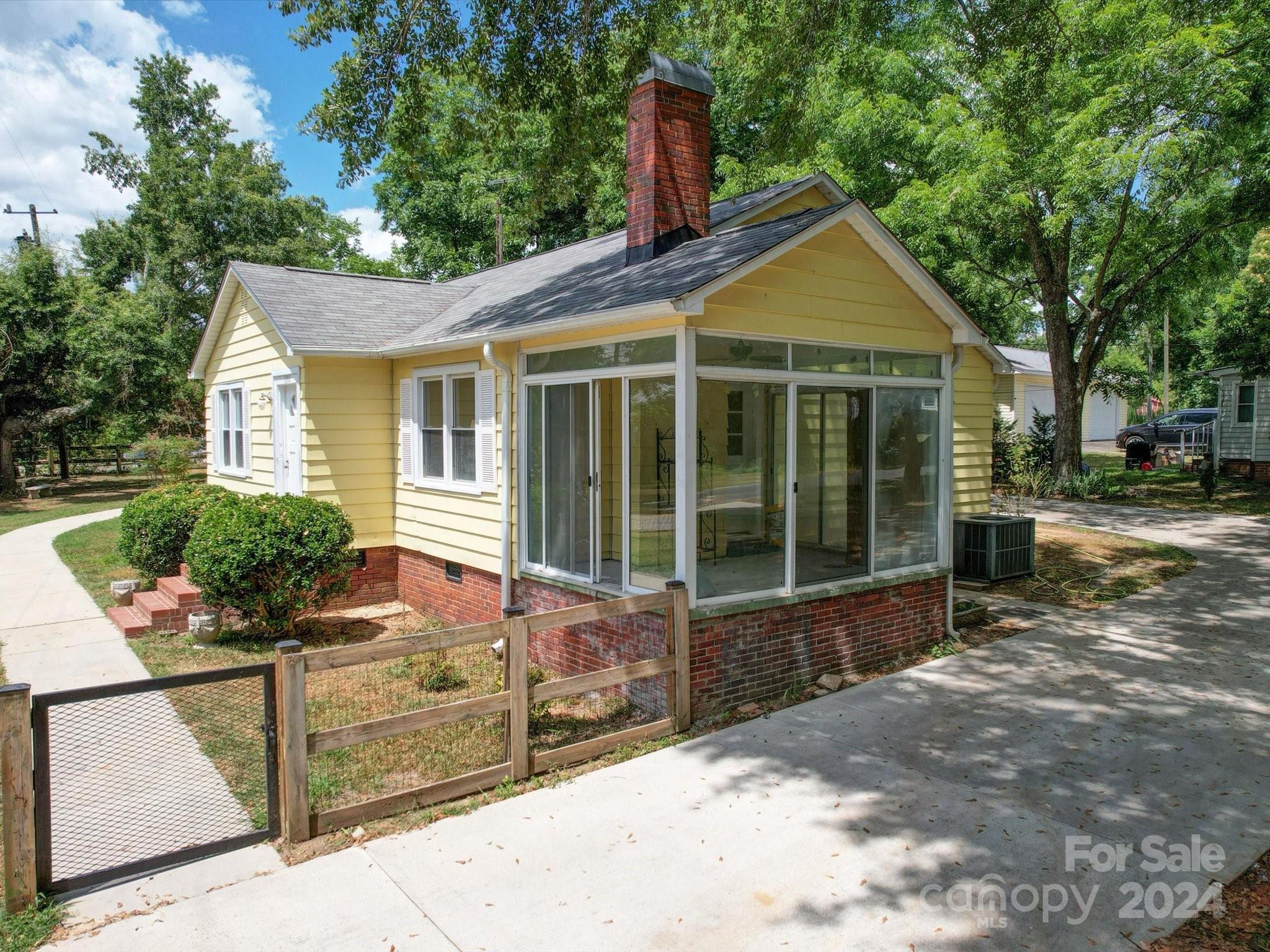 1102 White Store Road Wadesboro, NC 28170 - Photo 2 of 35 a front view of a house with garden