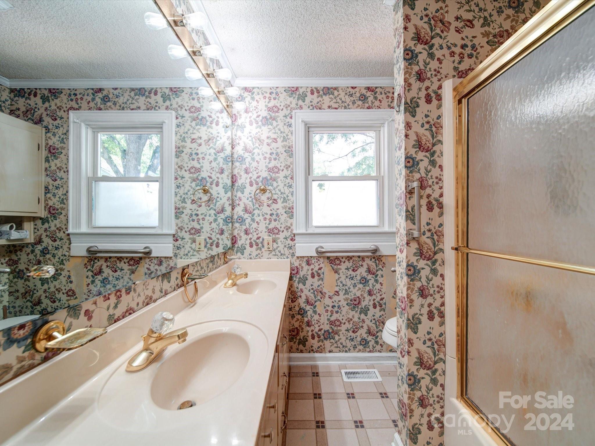 1102 White Store Road Wadesboro, NC 28170 - Photo 26 of 35 a bathroom with a granite countertop sink a mirror and a shower