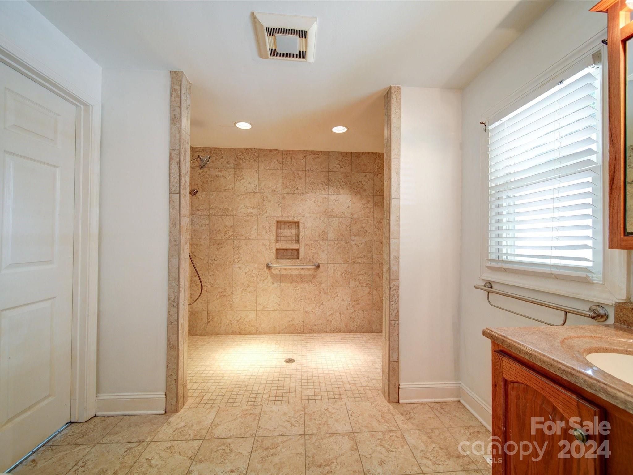 1102 White Store Road Wadesboro, NC 28170 - Photo 30 of 35 a bathroom with a sink a toilet and large mirror