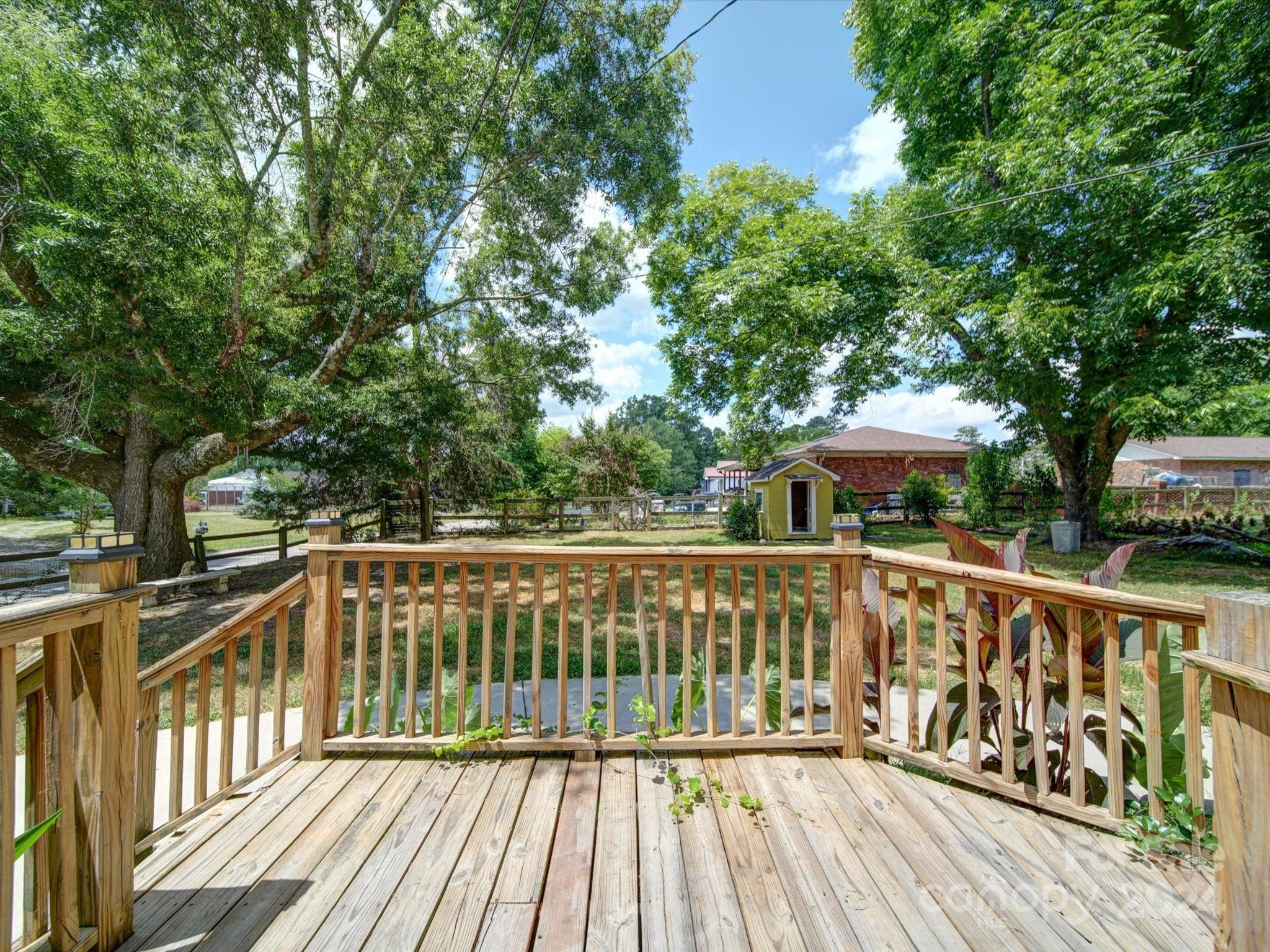 1102 White Store Road Wadesboro, NC 28170 - Photo 34 of 35 a view of a wooden deck with trees
