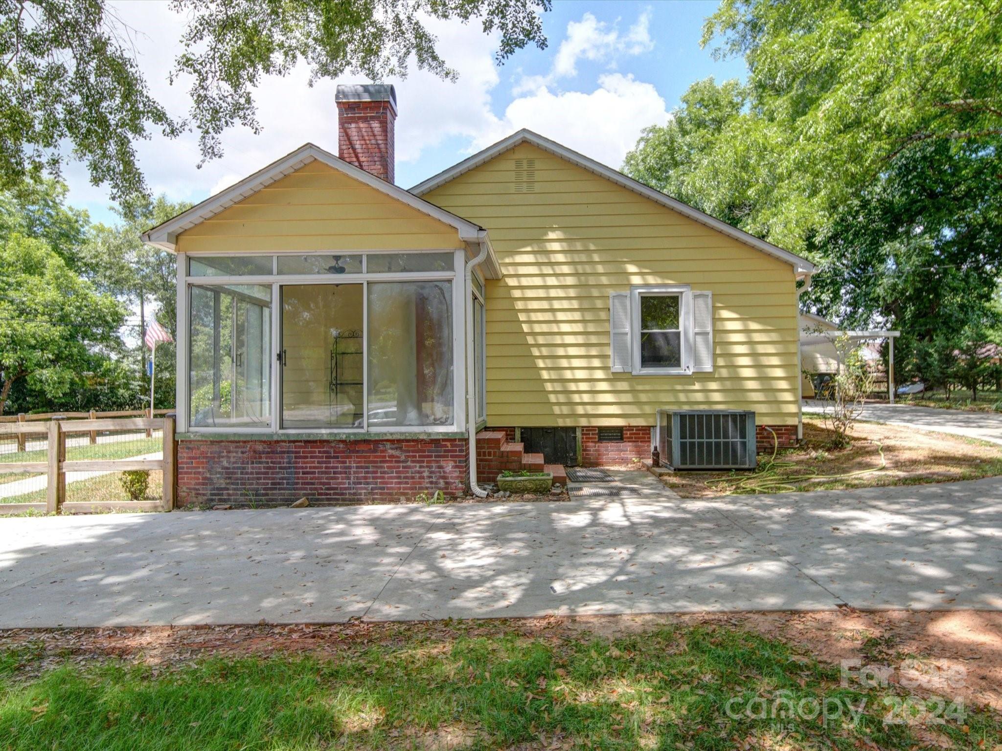 1102 White Store Road Wadesboro, NC 28170 - Photo 4 of 35 a front view of a house with a yard