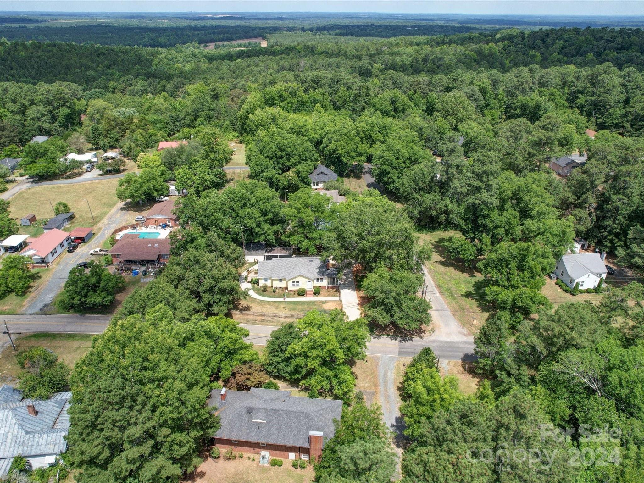 1102 White Store Road Wadesboro, NC 28170 - Photo 8 of 35 an aerial view of residential house with outdoor space and trees all around