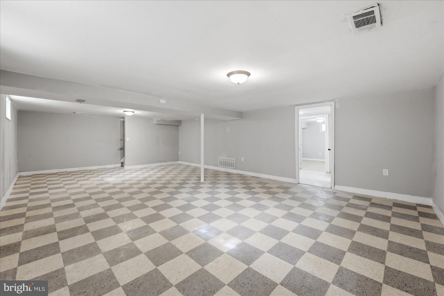 9110 Meadow Heights Road Randallstown, MD 21133 - Photo 27 of 39 Spacious, versatile basement retreat.