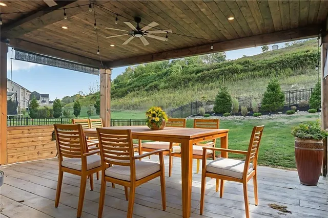 a dining area with furniture and outdoor space