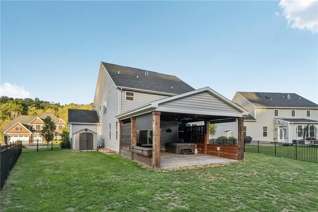 a view of a house with a yard porch and sitting area