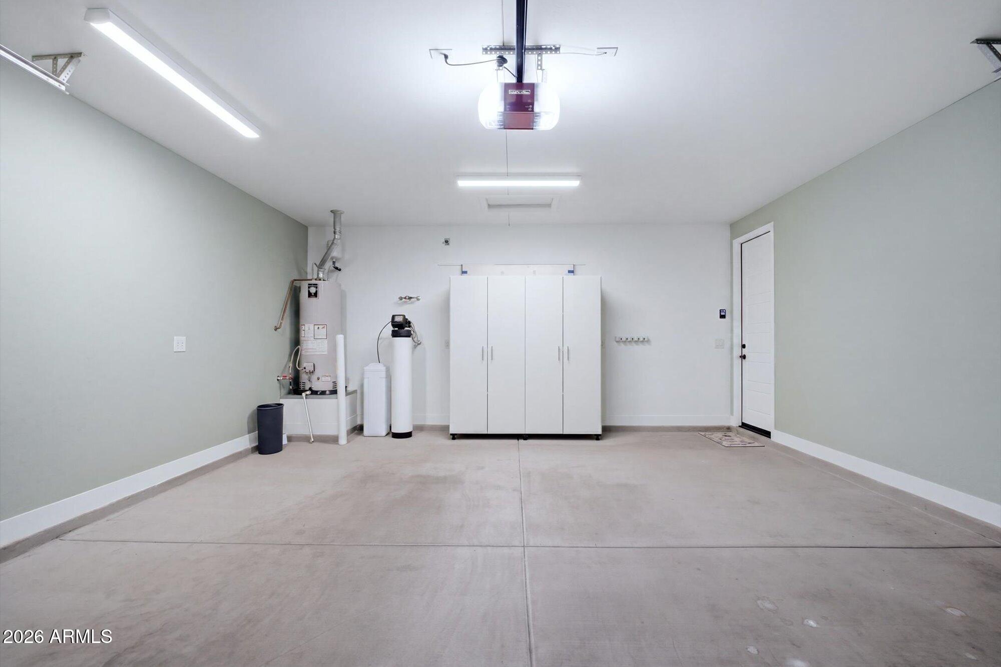 16849 West Merrell Street Goodyear, AZ 85395 - Photo 35 of 35 an empty room with an entryway and chandelier