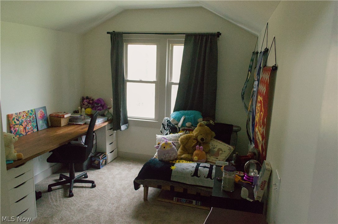 3187 Grenfall Road Barberton, OH 44203 - Photo 13 of 17 This room features a window providing natural light, warm neutral wall colors, and carpeted flooring