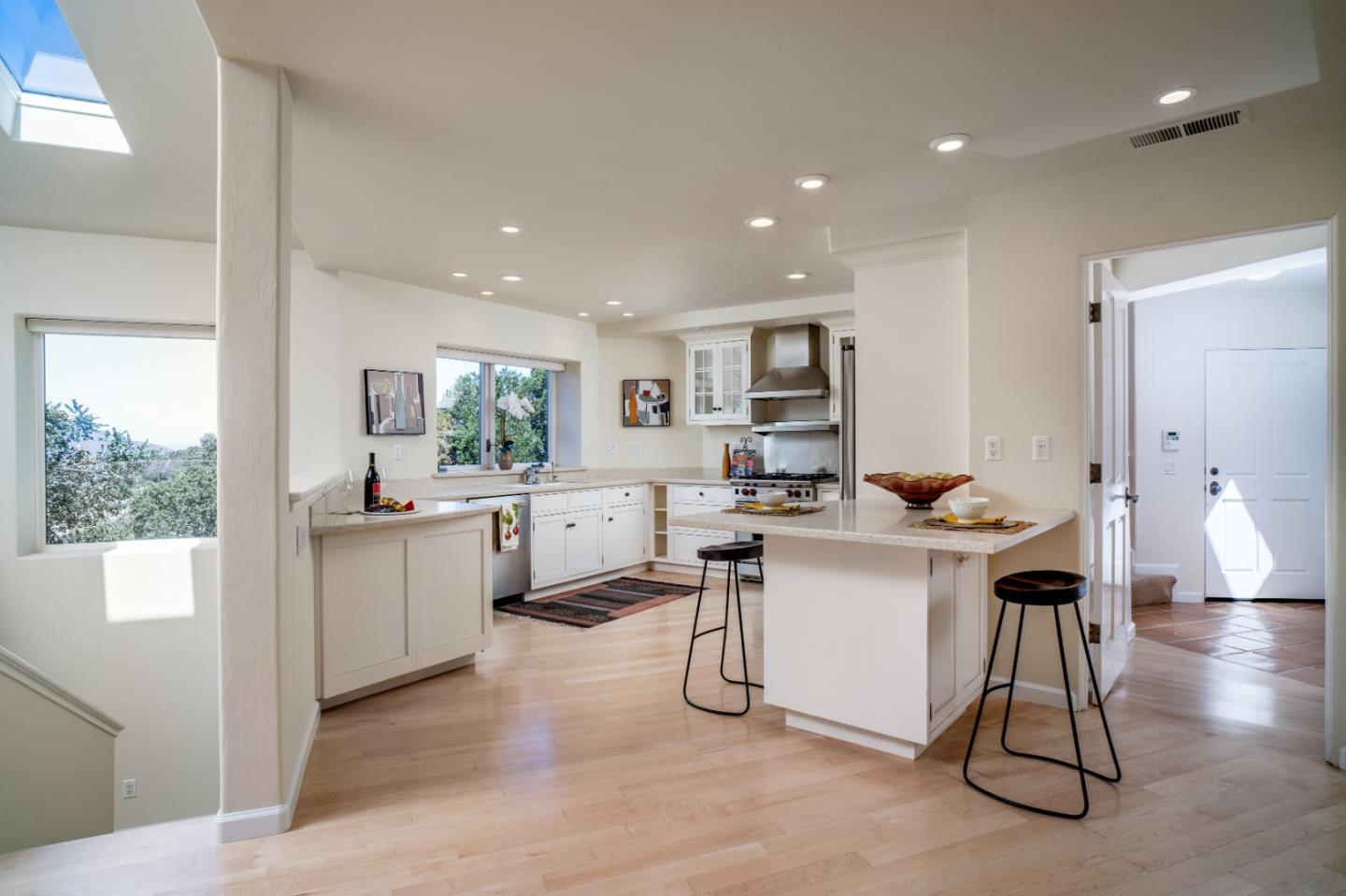 335 El Caminito Road Carmel Valley, CA 93924 - Photo 13 of 59 a kitchen with a sink cabinets and wooden floor
