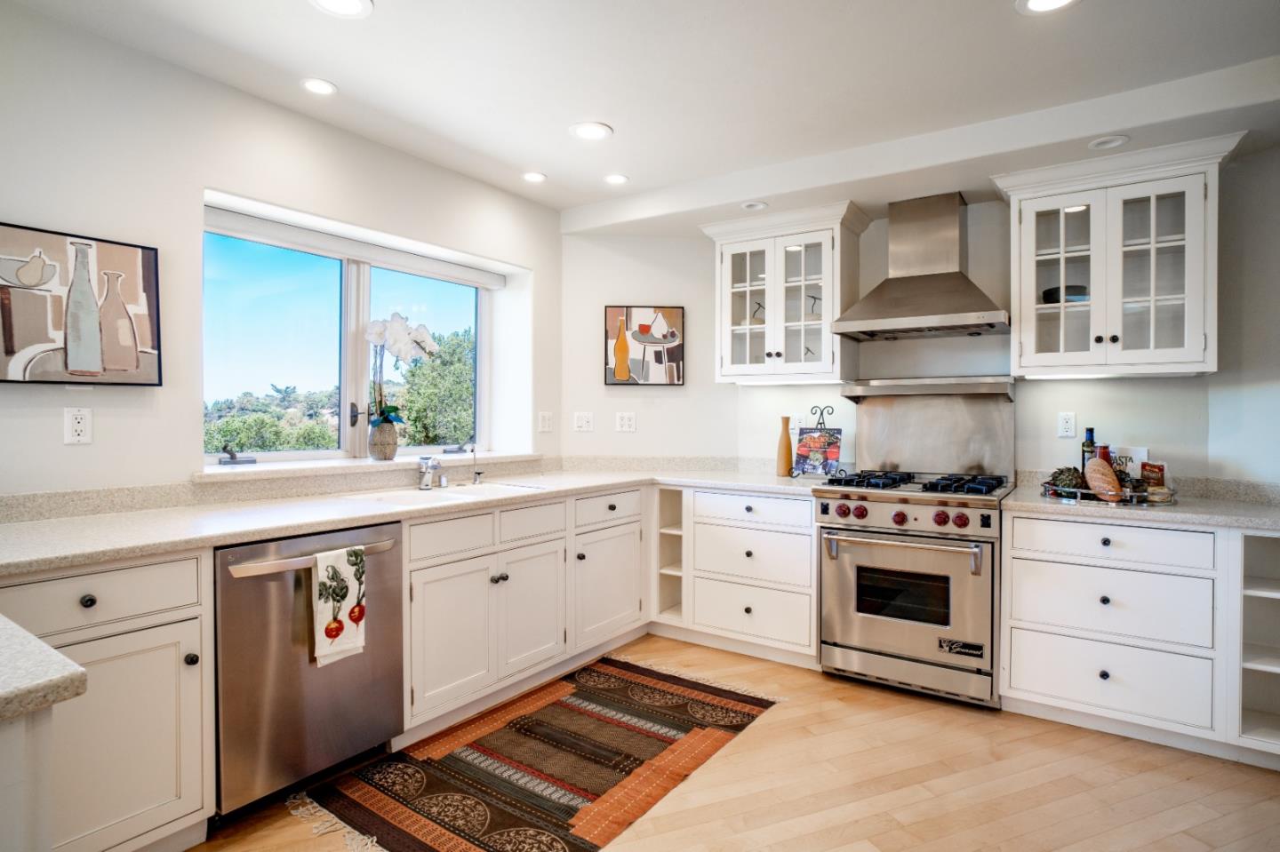335 El Caminito Road Carmel Valley, CA 93924 - Photo 16 of 59 a kitchen with stainless steel appliances granite countertop a stove and a sink