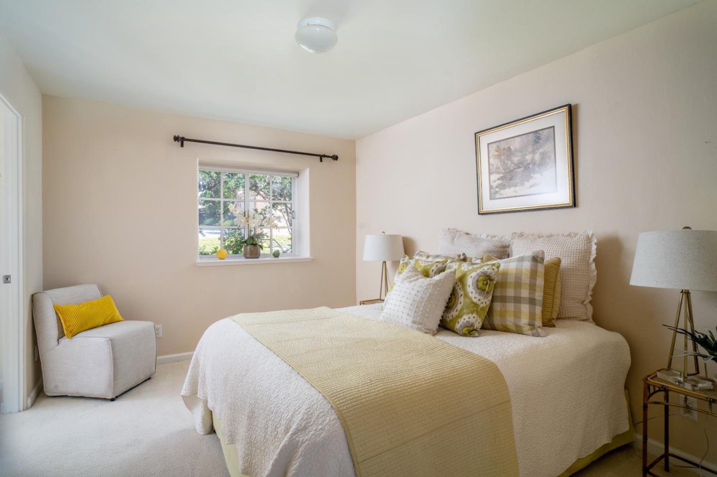 335 El Caminito Road Carmel Valley, CA 93924 - Photo 25 of 59 a bedroom with a bed and wooden floor