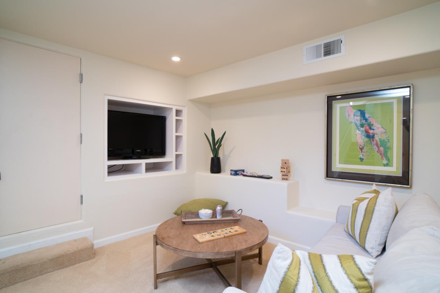 335 El Caminito Road Carmel Valley, CA 93924 - Photo 33 of 59 a living room with furniture and flat screen tv