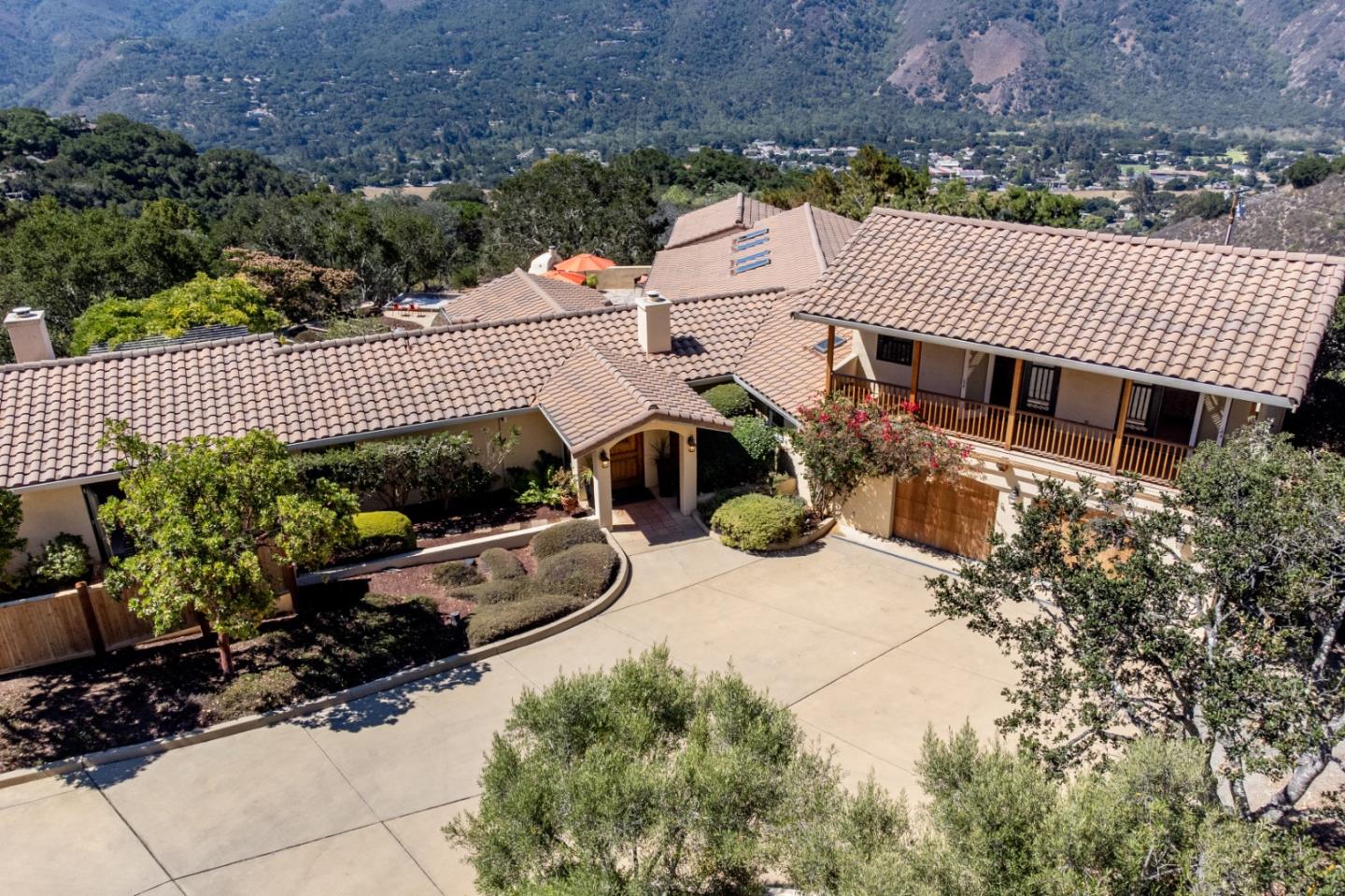 335 El Caminito Road Carmel Valley, CA 93924 - Photo 4 of 59 a view of a house with a flower garden
