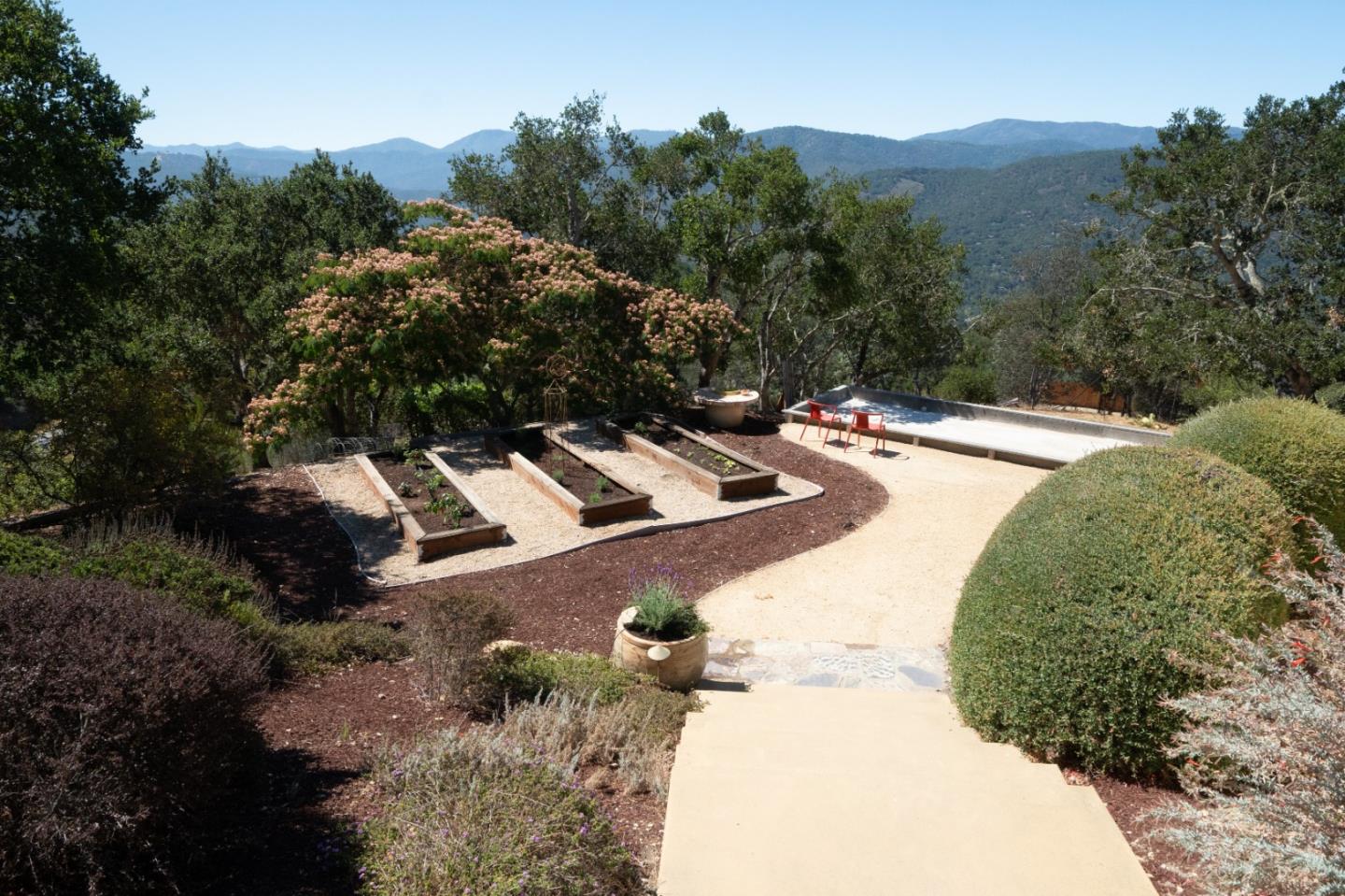 335 El Caminito Road Carmel Valley, CA 93924 - Photo 47 of 59 an aerial view of a house with a yard and trees