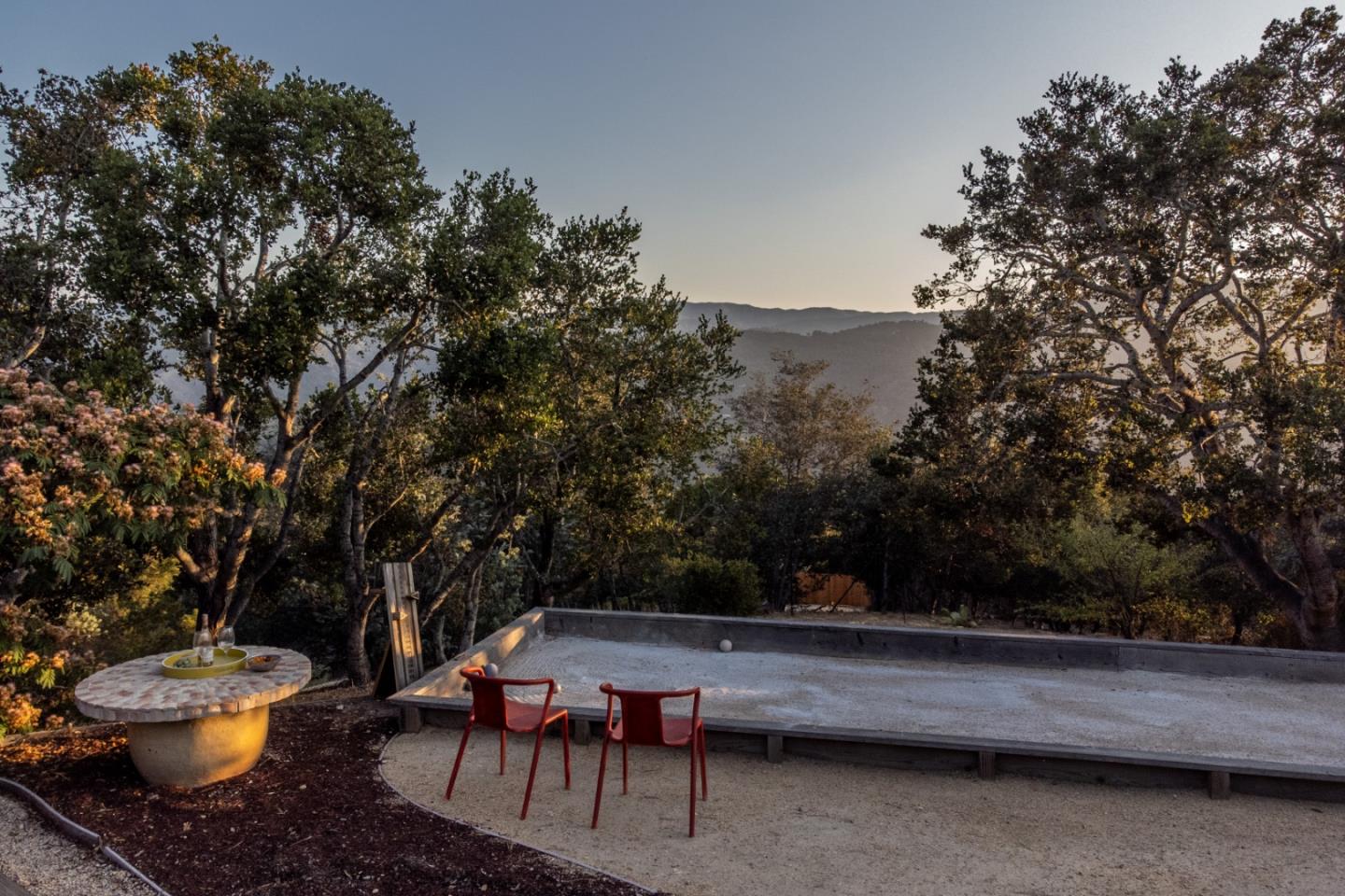 335 El Caminito Road Carmel Valley, CA 93924 - Photo 53 of 59 a backyard of a house with table and chairs