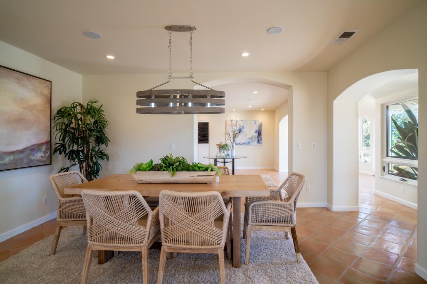 335 El Caminito Road Carmel Valley, CA 93924 - Photo 9 of 59 a view of a dining room with furniture wooden floor and chandelier