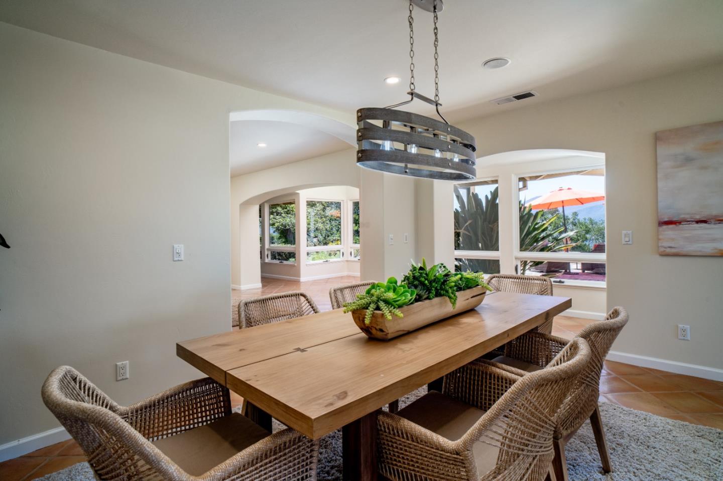 335 El Caminito Road Carmel Valley, CA 93924 - Photo 10 of 59 a view of a dining room with furniture window and wooden floor
