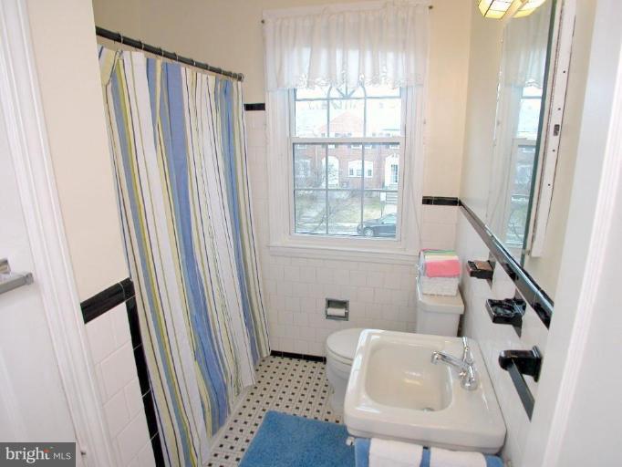 213 Blenheim Road Baltimore, MD 21212 - Photo 12 of 16 a bathroom with a sink and a tub