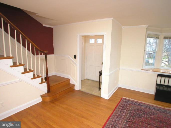 213 Blenheim Road Baltimore, MD 21212 - Photo 5 of 16 a view of entryway and hall with wooden floor