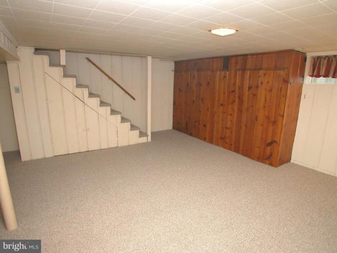 213 Blenheim Road Baltimore, MD 21212 - Photo 9 of 16 a view of an empty room with stairs
