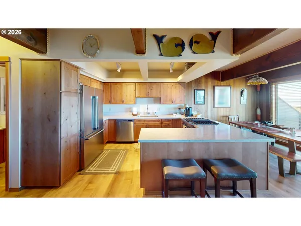 a kitchen with a table and chairs