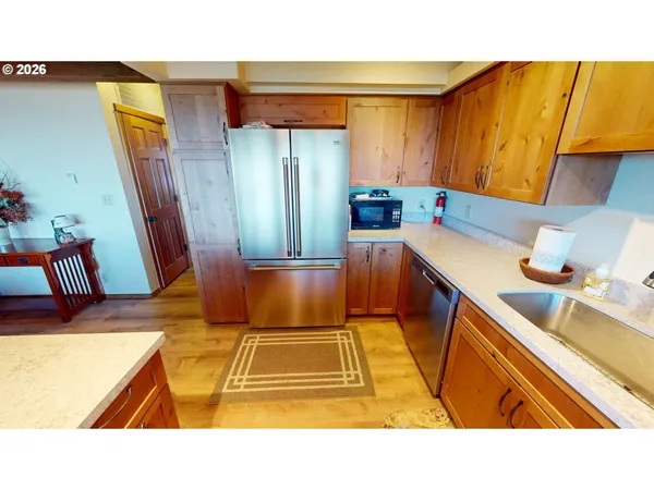 a kitchen with a sink and wooden cabinets